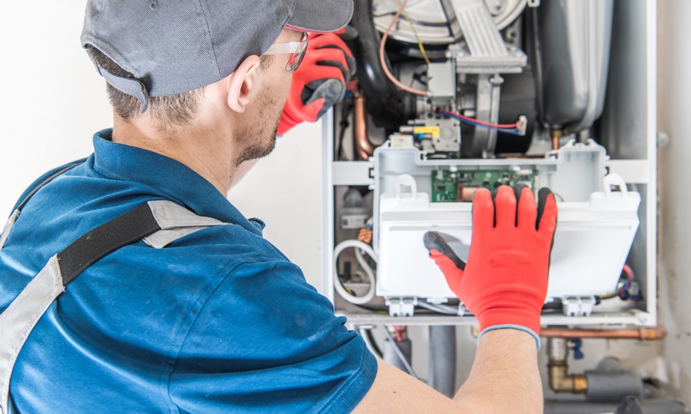 HVAC Tech working on a boiler