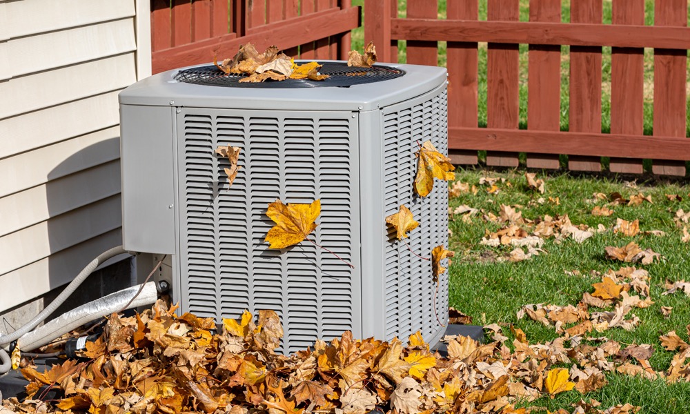 Condensing unit with fallen leaves around it